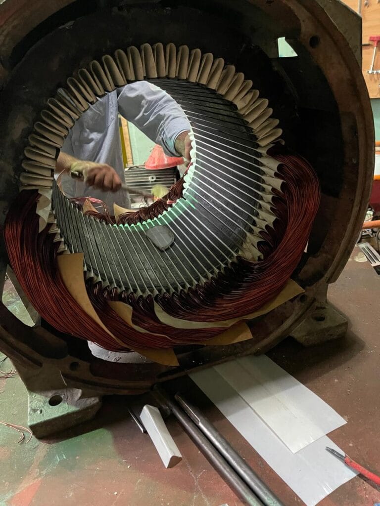 Technician rewinding AC motor in Dammam